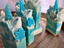 Load image into Gallery viewer, Snowflake the Magical Unicorn 5 Bars in shot. One laying flat with other standing in the bar. Shows many sides of the bars and details of the frosted tops.
