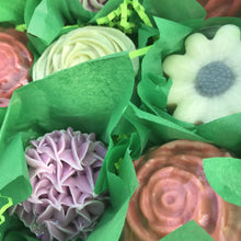 Load image into Gallery viewer, Close up of four soaps detailing the cute green tissue paper around each individually wrapped soap.
