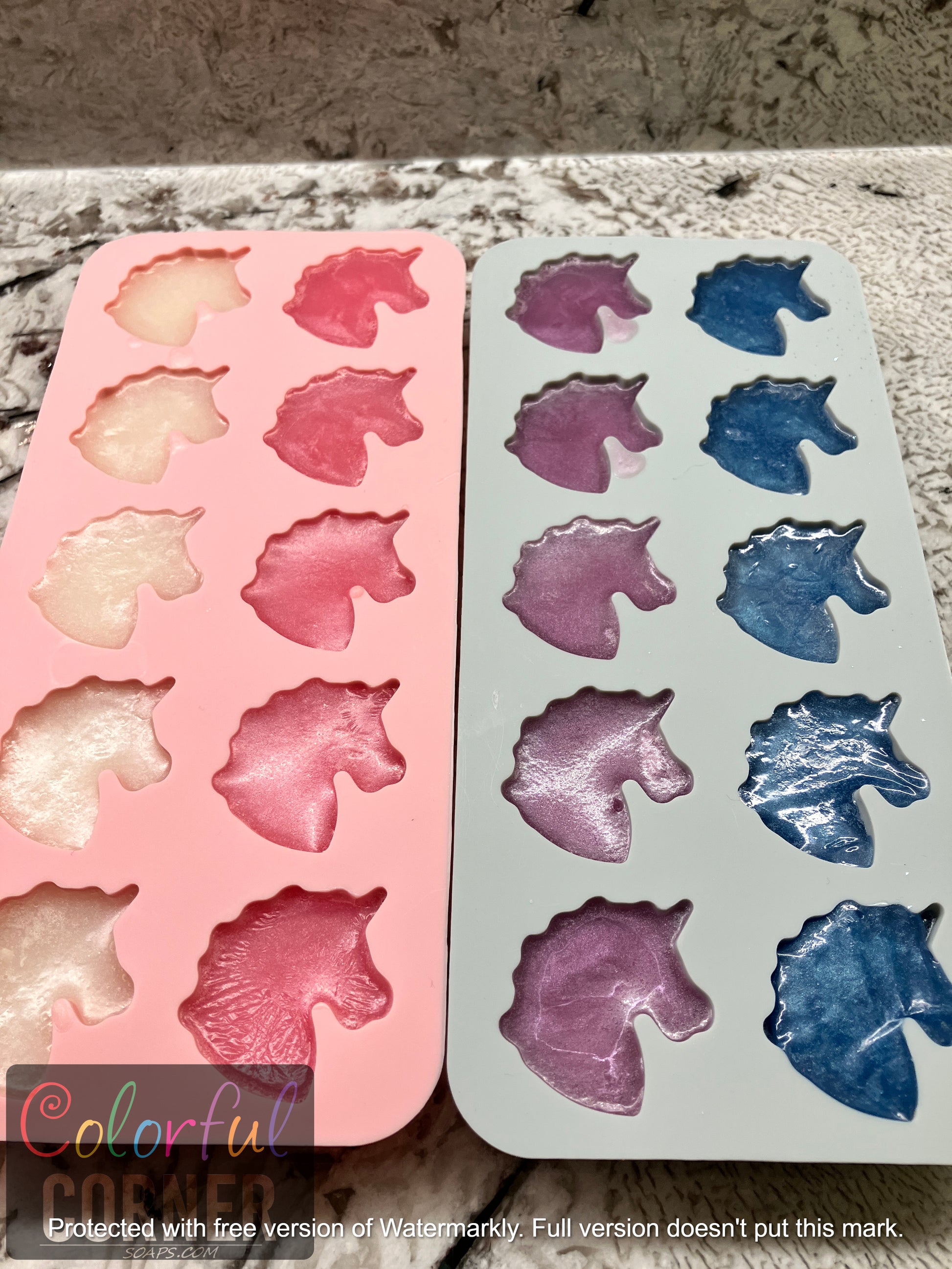 Unicorns shown in mold from left to right white, pink, purple and blue. Five in each column. 