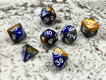 Load image into Gallery viewer, Set of seven dice for role play gaming. Shown in marine blue and gold with white numbering.
