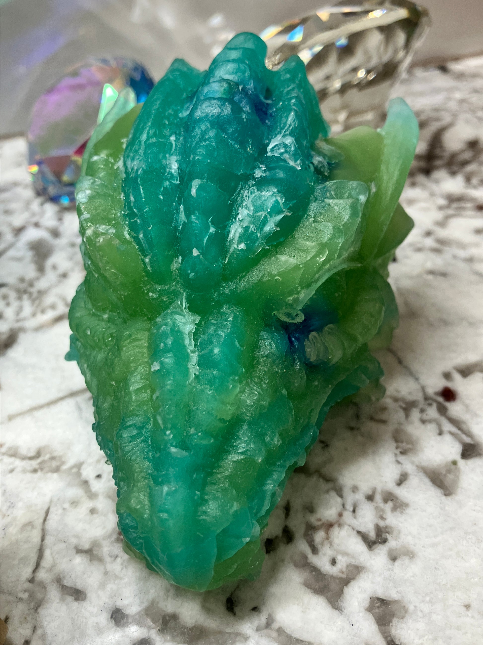 Green dragon head soap close up.