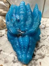 Load image into Gallery viewer, Vibrant blue dragon head shown up close can see a bit of the dice inside.
