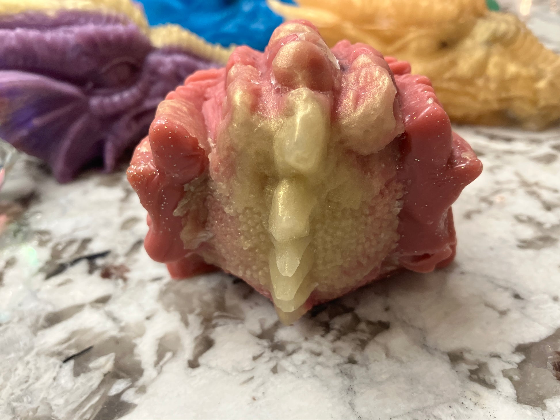 Back of red dragon head with golden stripe.