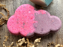 Load image into Gallery viewer, Hot pink and purple bath bomb shaped like a puffy cloud. 
