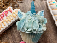 Load image into Gallery viewer, Close up of Unicorn Soap has a frosted appearing teal horn with teal painted ears and shaped like a cupcake.
